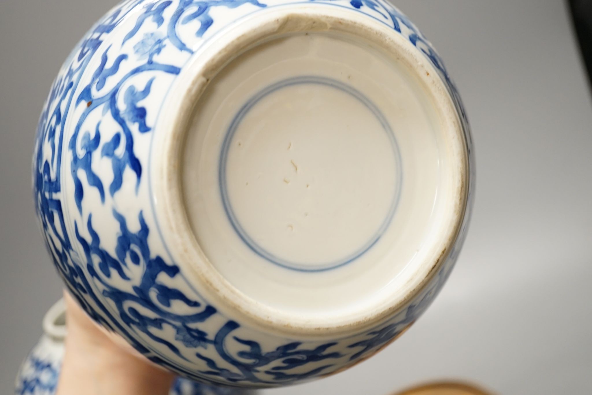 A pair of Chinese blue and white ginger jars and covers, 22cm, On stands